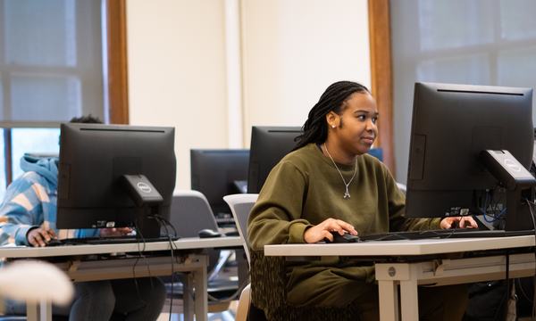 student using desktop computer