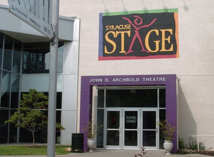Building with sign above that reads Syracuse Stage and John D. Archbold Theater above purple doorframe
