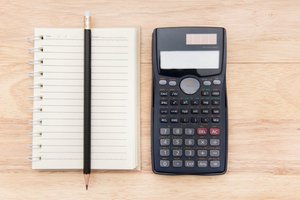 notepad and calculator on a desk