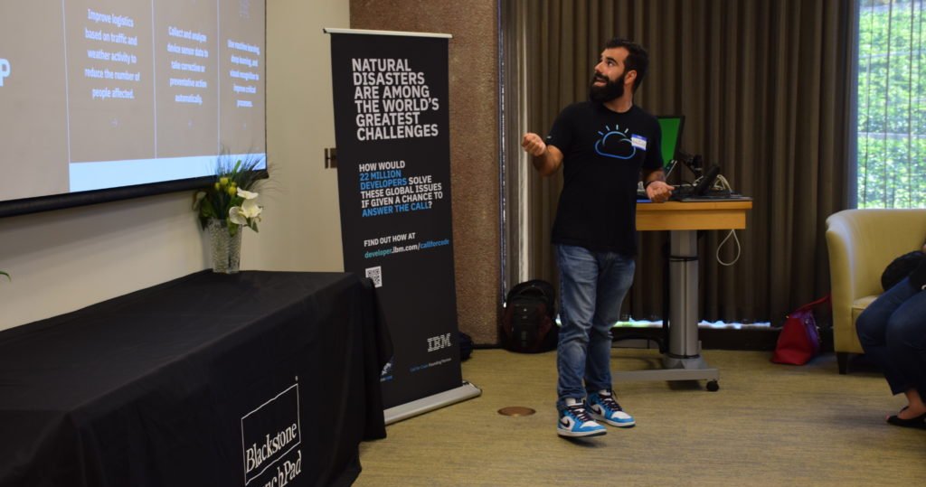 a man presents at the call of code hackathon