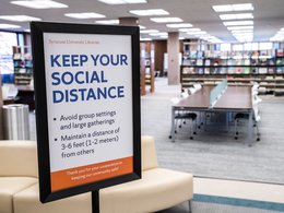 "Keep Your Social Distance" signs in Bird Library announcing COVID-19 protocols