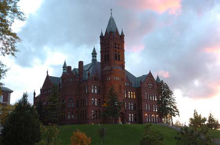 iconic Romanesque revival/Gothic architecture building resembling castle made of red sandstone