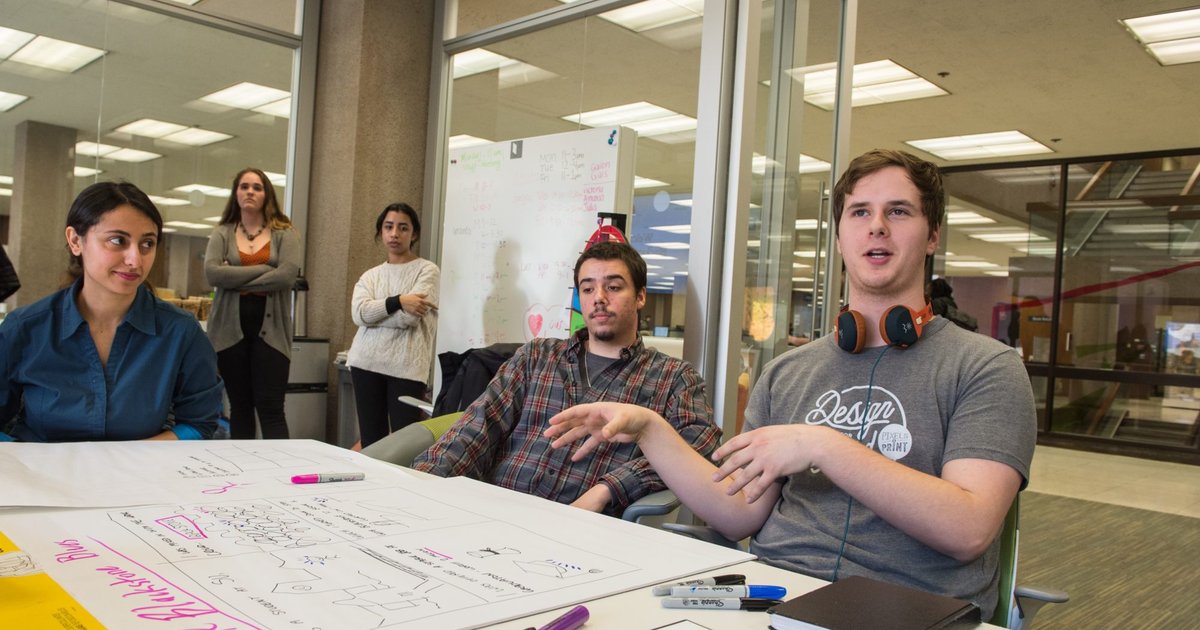 students brainstorming at table
