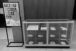 word "Tectonilonical" letters in reversed out red and black squares