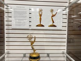 emmy's and description on display in case