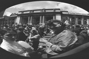 distorted photo of crowd in front of building