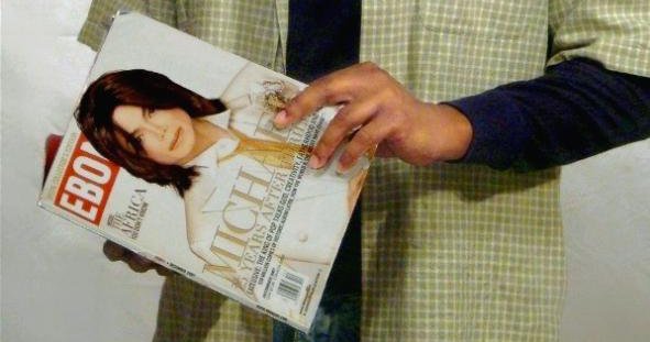 Black man holding Ebony magazine