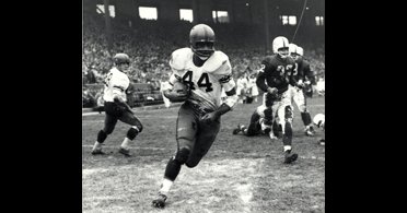 B&W still of football player wearing #44