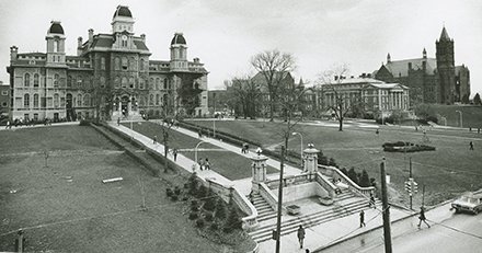black and white aerial photo at angle that shows wall of remembrance and path walkway to Hall of Languages; other campus buildings to right