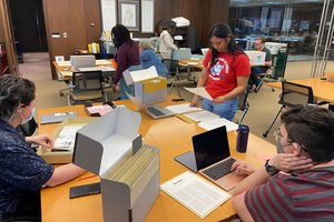 Students in SPE 644 working with primary source materials in the Special Collections Research Center.