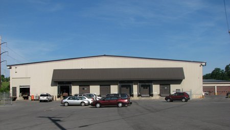 beige warehouse building with loading docks