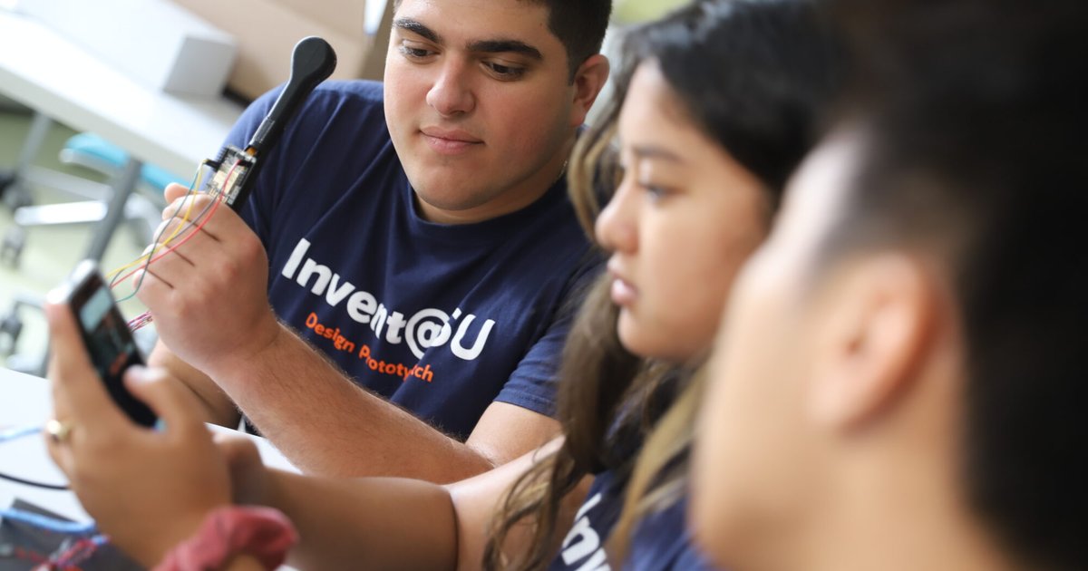 three students working on project