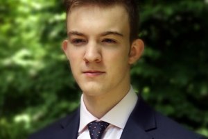 student in a jacket and tie
