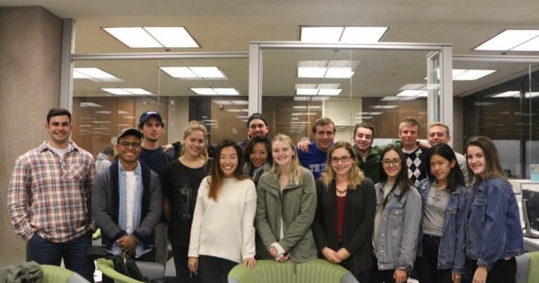 a group of students pose for a photo