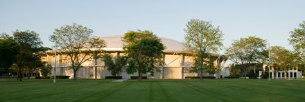 white rounded buildng with white roof