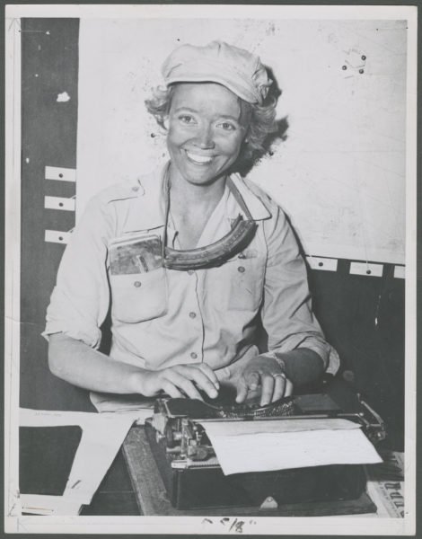 Marguerite Higgins typing on typewriter
