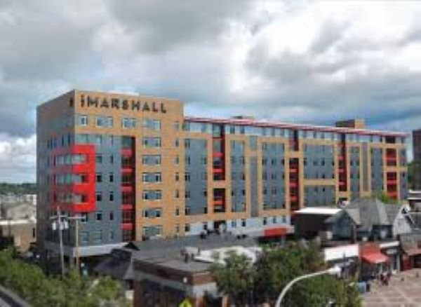 8 story brick building with red accents