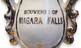 White and gold china that reads Souvenir of Niagara Falls