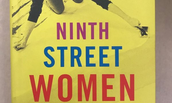 Yellow book cover with a woman creating art above the title.