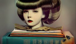 female doll head atop books