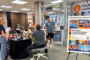 Students check-in alumni at the Blackstone LaunchPad