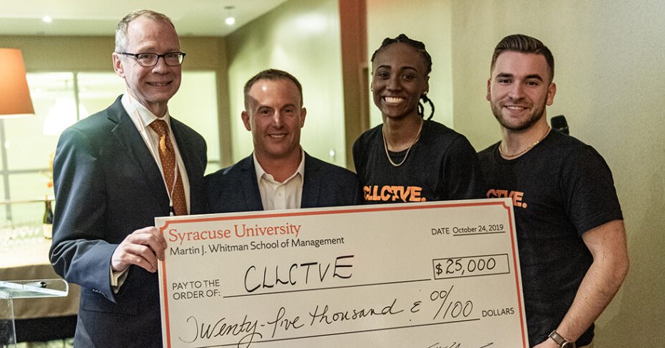 people holding an oversized check