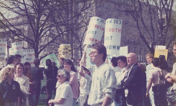 people standing outside protesting