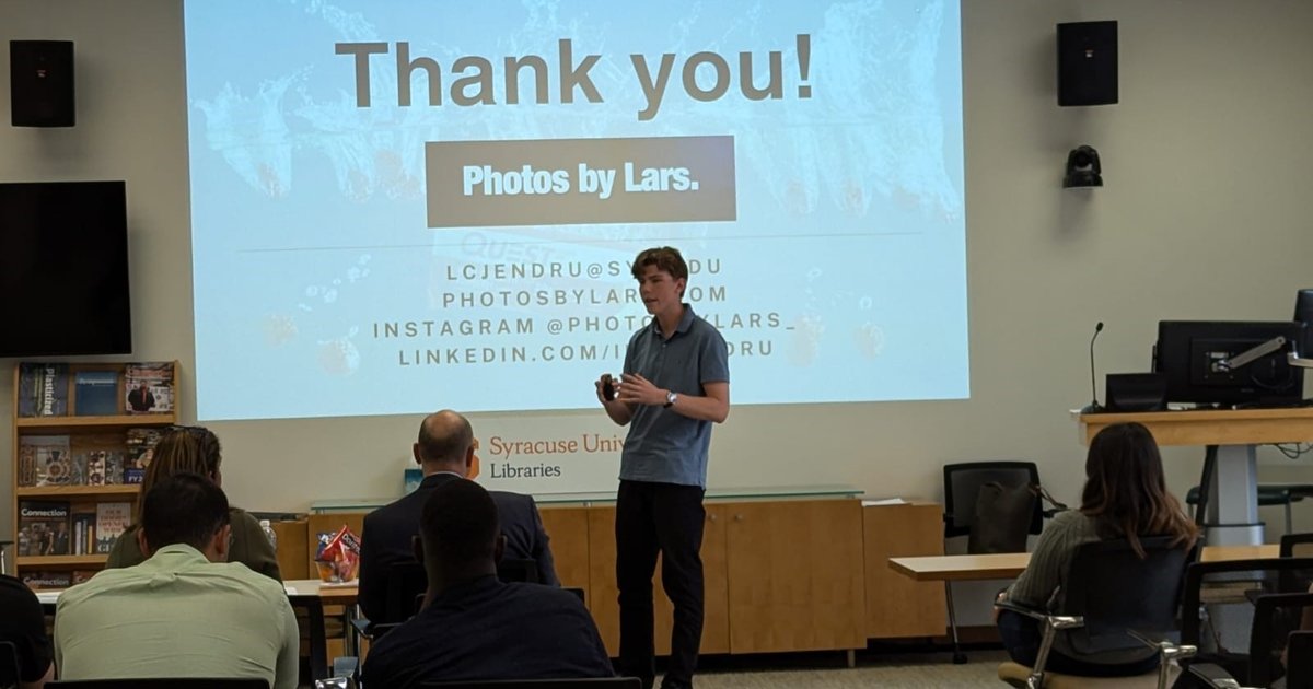 person standing in front of powerpoint presentation