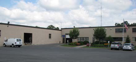 one story L-shaped tan building