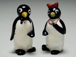two miniature plastic penguins