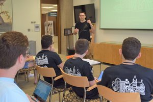 students listen to the presenter