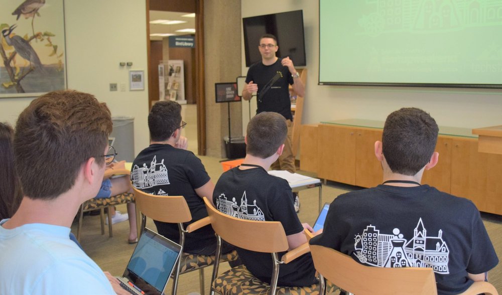 students listen to the presenter