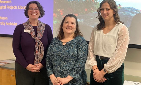 3 people standing in front of screen