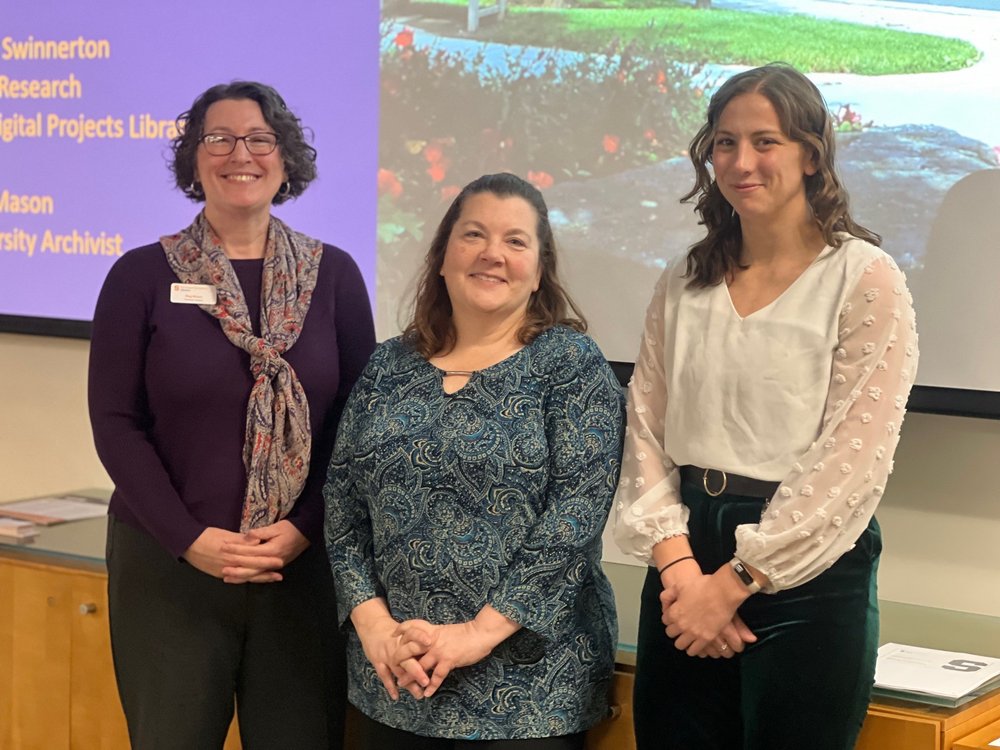 3 people standing in front of screen