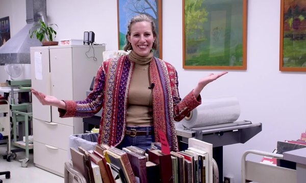 student employees working on book repairs
