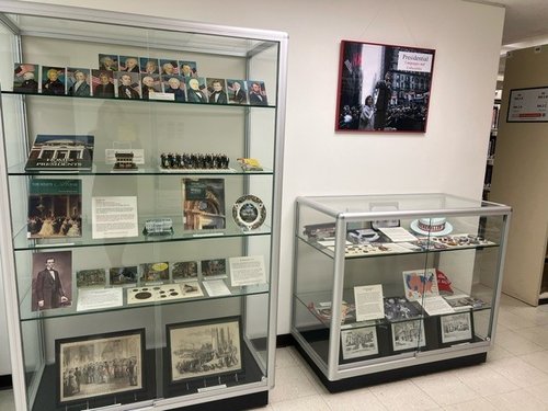 2 display cases with photos of presidents