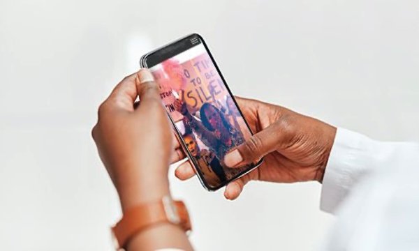 print to pixels is title at top with photo of hands looking at image on cell phone