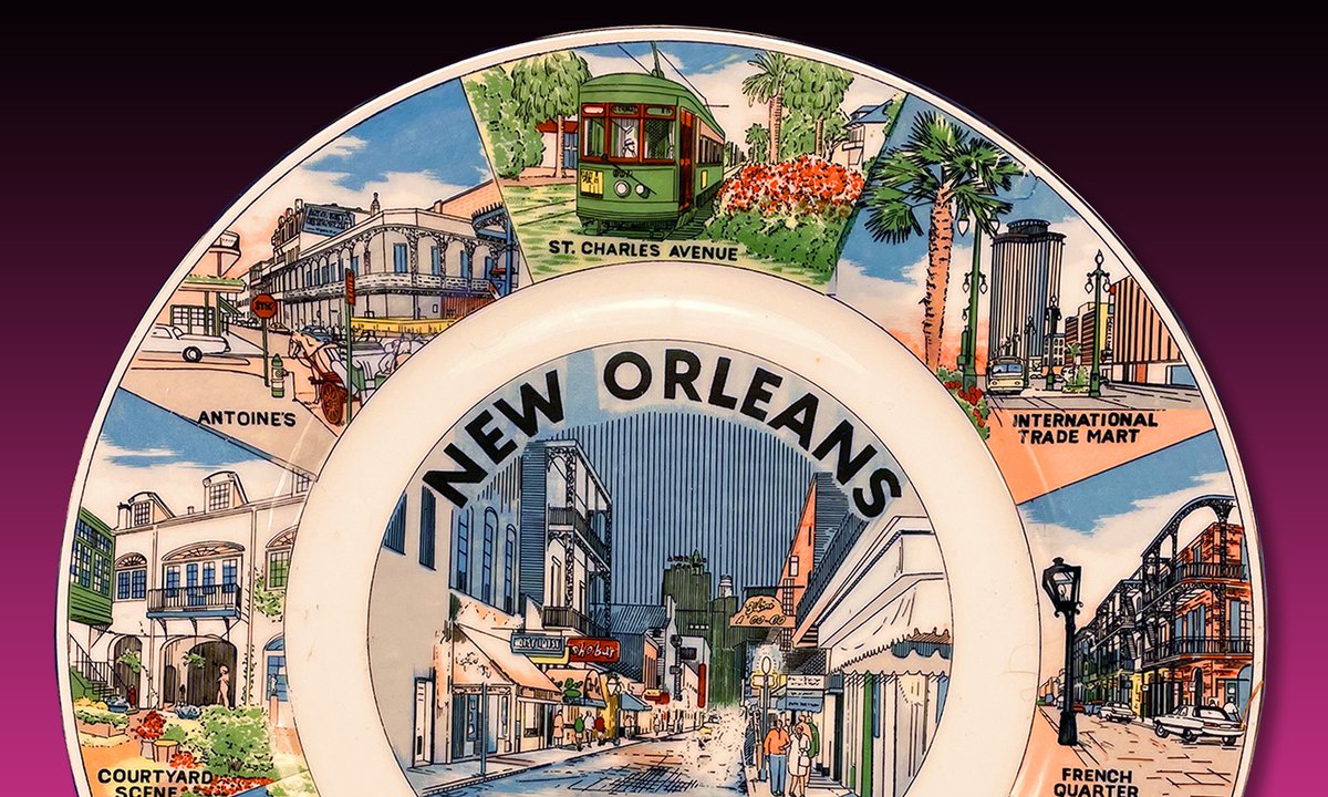 souvenir plate of Louisiana, with words 'New Orleans' at top and drawings of various tourist sites around the perimeter of the plate