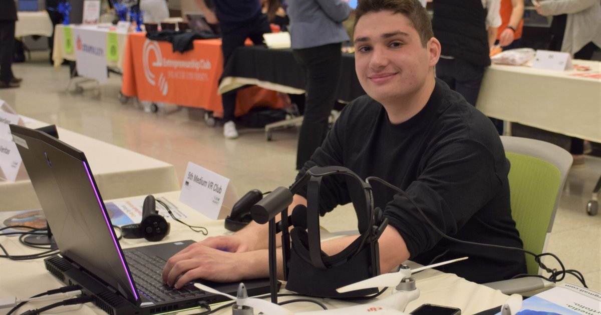 student at a recruitment fair