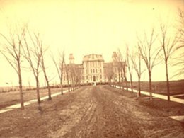 old photo of exterior Hall of Languages building with open land surrounding it