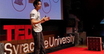 man on tedx stage