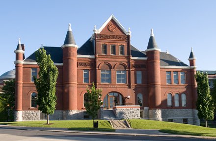 grand Romanesque style red brick castle building