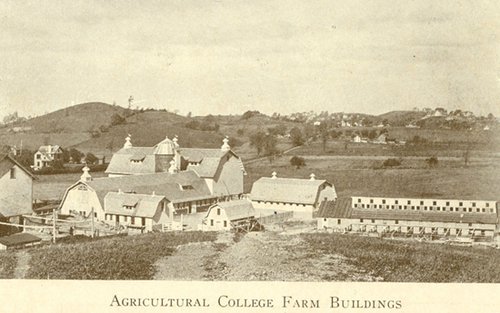 several barns and land surrounding. Agricultural College Farm Buildings labeled at bottom of image