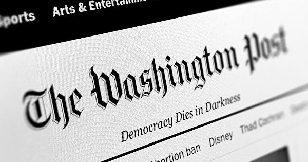 logo of Washington Post with tagline "Democracy Dies in Darkness"