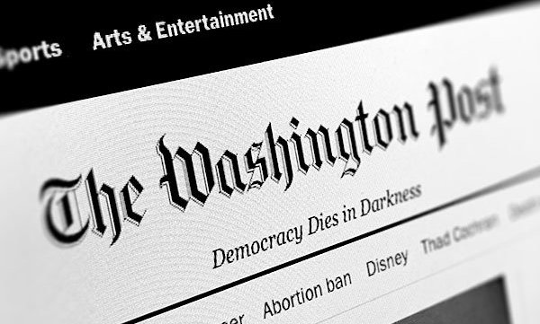 logo of Washington Post with tagline "Democracy Dies in Darkness"