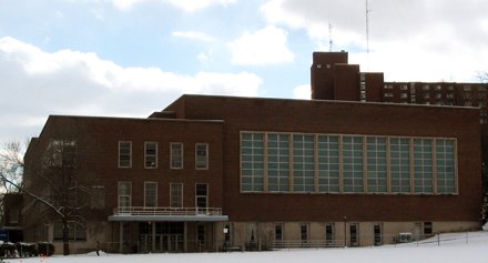 brick building with side-by-side small glass windows