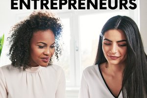 two women looking at laptop